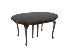 an oval wooden table with four legs and a dark wood finish on the top, against a white background