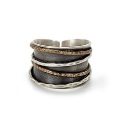 Alternating bands of hand hammered gold and sterling silver create interesting visual and textural contrast to the wide silver band ring with oxidized interior. Beautifully designed unique mixed metal ring. Designed and handmade in the J & I Philadelphia studio of Jessica and Ian Gibson. Comes in a gift box. Modern Rings, Mixed Metal Ring, Wide Silver Band, Hammered Gold, Wide Rings, Modern Ring, Handmade Rings, Silver Band Ring, Metal Ring