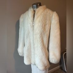 Beautiful Vintage Faux Fur Winter Coat. Excellent Condition With No Stains, Holes, Rips, Or Tears. Color Is Off White/Very Light Cream Alternating Chevrons On Main Portion Of Coat With Solid Off White Sleeves And Trim. Interior Satin Lining With Floral Design. Made By Sportowne Offered By Giddinf Jenny. This Is A Seriously Beautiful Vintage Luxe Coat! Perfect For A Winter Wedding Or Or Just To Look Fab! P2p 20” Bust 40” Center Back Length 27” Fur Winter Coat, Vintage Faux Fur Coat, White Sleeves, Winter Fur Coats, Light Cream, Chevron Pattern, Faux Fur Coat, Winter White, Coats Jackets Women