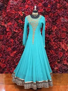 Go all out in this beautiful Anarkali, which is sure to bring out the innate grace and grandeur in you! Color -Dark Turquoise Blue Fabric & Work Style - - Soft Lycra stretchable fabric. Details - - Assured quality - Wash care instruction: Dry clean only. - Slight variation in color is possible due to digital photography. Blue Floor-length Dupatta With Dabka, Floor-length Fitted Churidar For Reception, Fitted Floor-length Churidar For Reception, Blue Fitted Long Sleeve Anarkali Set, Blue Dabka Dress For Reception, Blue Anarkali Gown With Dabka, Blue Dabka Anarkali Set For Party, Anarkali Blue Gown With Dabka, Unstitched Blue Gown With Dabka Work