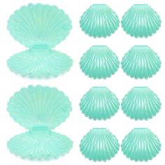 six green seashells are shown on a white background, each with different shapes and sizes