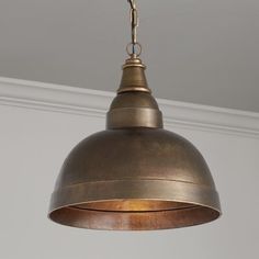 an antique brass pendant light hanging from a ceiling in a room with white walls and mold mold mold mold mold mold mold mold mold mold mold