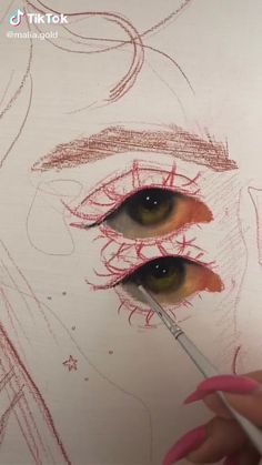 a woman's eye is being drawn with colored pencils on a sheet of paper