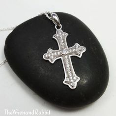 "Sterling Cross necklace - cross pendant - cubic zirconia - religious jewelry - silver cross - Christian - Catholic - gothic cross - tween ---------------- Beautiful genuine solid sterling silver Cross with set cubic zirconia gems - approx 1\" long not incl. bail, note that mannequin is not life size. - choose your length of sterling silver chain Makes a nice gift for a christening or confirmation For more affordable sterling silver jewelry: www.etsy.com/shop/thewrenandrabbit For Buddha, Yoga, H