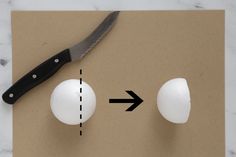 an egg being cut in half with a knife