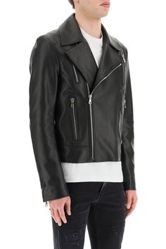 Balmain biker jacket in soft lambskin leather, with lapel collar and off-center zip closure. Four zip pockets, topstitched details on the sleeves and on the back, lower-sleeve zip insert. Twill-cotton lined interior with logo print and two welt leather pockets, regular fit. The model is 187 cm tall and wears a size IT 48. Size Info IT Color Detail Black Made In Turchia Material 100% Lambskin Season One spring Season Two summer Product clothing Brand Balmain Size And Fit 2023 Color, Latest Fashion Design, Leather Biker Jacket, Edgy Look, Spring Season, Couture Collection, Roberto Cavalli, Lapel Collar, Lambskin Leather