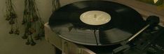 an old record player sitting on top of a table