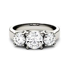 three stone engagement ring with four diamonds on the sides and an accent band in white gold