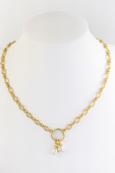 Behold the majestic elegance of this necklace! Exquisitely stylish, its 22" gold chain featuring a pearl drop and diamond rectangle charm ensures you are the center of attention. An ideal addition to your solo or layered look; combine it with a choker or wear it alone to experience a level of joy. Meticulously crafted with gold filled and nickel free material. Gold Square Pearl Pendant Jewelry, Gold Square Pendant Jewelry With Pearl, Gold Chain Necklace With Rectangular Pendant, Elegant Gold Chain Necklace With Rectangular Pendant, Gold Toggle Necklace With Pearl Charm, Elegant Gold Toggle Necklace With Pearl Charm, Gold Chain Necklace With Pearl Charm Dangle, Elegant Gold Charm Necklace With Rectangular Pendant, Elegant Gold Plated Charm Necklaces With Rectangular Pendant