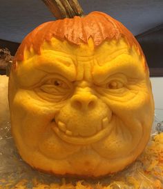 a carved pumpkin with an evil face on it