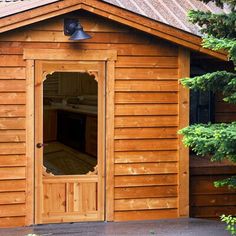 a wooden building with a large open door