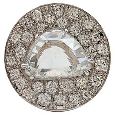 a large diamond ring with lots of diamonds around it