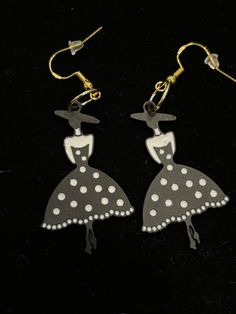 "Dripping oil alloy earrings with hypoallergenic ear wires.  A lovely woman in a black and white polka dot dress and stylish hat earrings.  An Ellie's Original Design. This is part of the \"Rodeo Drive\" Collection - enjoy yourself!" Black Retro Earrings, Black Party Earrings For Summer, Cute Black Party Earrings, Elegant Black Earrings For Spring, Dress Earrings, Woman In Black, Snowflake Earrings, Rodeo Drive, White Polka Dot Dress