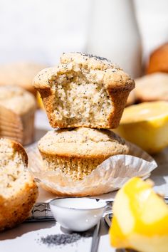 muffins stacked on top of each other next to some lemon slices and bananas