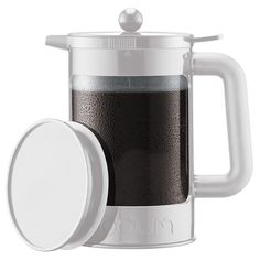 a french press coffee maker with a lid