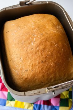 a loaf of bread in a metal pan