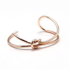 Classic design with a modern flair, our Knotty or Nice Cuff is minimalist jewelry at its finest. This is the bracelet you will be grabbing day after day! Material: Copper Finish: Gold Plated, Silver Plated, Matte Black Adjustable Rose Gold Minimalist Cuff Bracelet, Trendy Rose Gold Metal Cuff Bracelet, Chic Rose Gold Metal Cuff Bracelet, Adjustable Modern Rose Gold Bangle, Adjustable Minimalist Metal Cuff Bracelet, Modern Rose Gold Cuff Bracelet As Gift, Modern Rose Gold Cuff Bracelet Gift, Minimalism Design, Double Knot