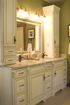 a bathroom with double sinks and two mirrors