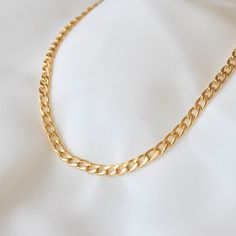 "Chunky and trendy, this necklace features thick chain links that measure 0.5 cm wide. 18K gold-plated stainless steel features a deeper, more saturated yellow color compared to 14K gold filled items. tarnish-resistant, water-resistant, and hypoallergenic. Lengths 13 inches and under will come with an additional 2 inch extension so that you can adjust it to fit perfectly and comfortably. --------------------♥ PROMOS ♥-------------------- Want 10% off? Join the mailing list by visiting http://bit Minimalist Gold Plated Cuban Link Chain Necklace, Gold Plated Curb Chain Link Necklace, Minimalist Gold-plated Curb Chain Necklace, Trendy Curb Chain Choker Necklace, Gold Link Choker For Gifts, Dainty Link Chain Necklace With Curb Chain, Minimalist Curb Chain Link Necklace, Dainty Curb Chain Link Necklace, Minimalist Metal Curb Chain Necklace