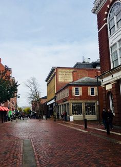 an empty street with people walking on it