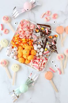 an assortment of candies and candy on a plate