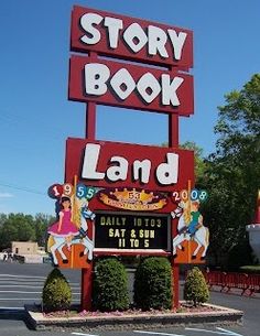 the story book land sign is located in front of an amusement park