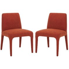 two orange chairs sitting next to each other