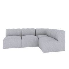 a large gray couch sitting on top of a white floor