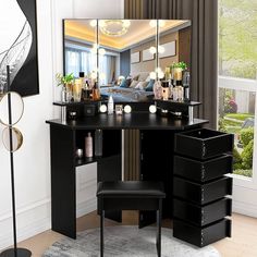 a dressing table with mirror, stool and lights