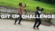 two men are dancing in front of a stone wall with the words git up challenge