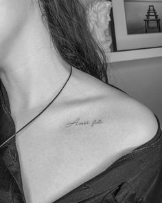 a woman's chest with the word love you written in cursive font