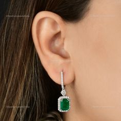 "This fabulous Handmade Earrings is the right choice for you to dress to impress. It is made with 18k White Gold along with the Zambian Emerald studding and the spectacular design adds to its glittering. ✧✧Welcome To Our Shop Spectrum Jewels India✧✧ \"\"18k White Gold Zambian Emerald Earrings For Women, Natural Diamond Hoop Earrings For Birthday Gift, Valentine Earrings Jewelry For Wife\"\" ★PRODUCT SPECIFICATION★ * ITEM CODE - SEE-11717 * EARRING LENGTH - 32 Millimetres Approx * METAL - 18k White Gold * 18k White Gold Weight : 5.72 gm  * GROSS WEIGHT - 6.88 gm Approx * MAKING - Handmade ★MAIN STONE DETAILS★ * STONE NAME:- Zambian Emerald, Diamond * STONE SHAPE:- Octagon * DIAMOND WEIGHT:- 1.06 Carat * AVERAGE DIAMOND CLARITY :- SI1-S2  * DIAMOND COLOR :- H-I * STONE WEIGHT:- 4.72 Carat * Valentines Earrings, Solitaire Earrings, Zambian Emerald, Emerald Pendant, Peridot Ring, Diamond Hoop Earrings, Emerald Earrings, Diamond Stone, Birthstone Jewelry