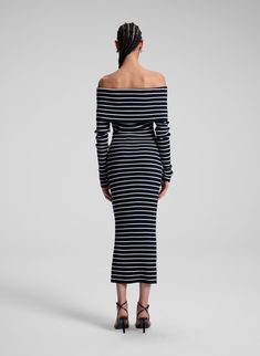 The Evelyn Dress is crafted from ultra-fine Italian stretch merino wool in a navy and white stripe motif. This off-the-shoulder midi silhouette features a second-skin fit, long sleeves, and ribbed detailing, blending sleekness with ease. Shop Dresses. Styling Tip: Pair with minimal flats and an oversized utility coat for discerning off-duty style. Off Shoulder Midi Dress, Black And White Striped Dress, White Striped Dress, Shop Dresses, Second Skin, Off Duty, Striped Dress, Navy And White, Blending