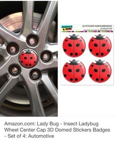 four red ladybugs on the side of a car wheel