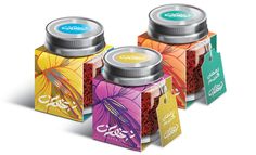 three different flavors of tea are shown in the packaging design for this product, each with its own unique label