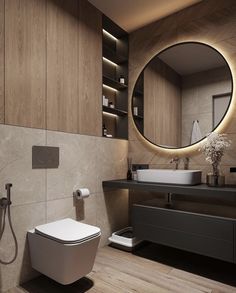 a modern bathroom with a round mirror above the sink