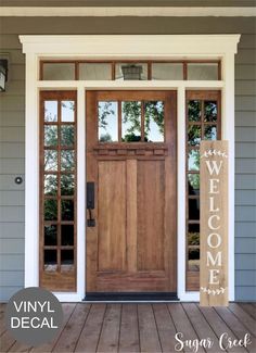 the front door to a house with two sidelights on each side and an open window