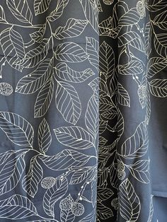 black and white fabric with leaves on it