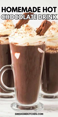 two glasses filled with hot chocolate drink and topped with whipped cream