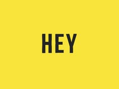 the word hey written in black on a yellow background