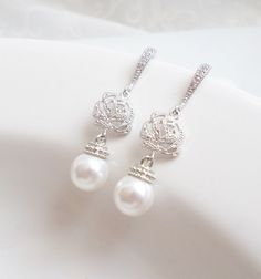 These lovely enchanted rose earrings with Swarovski pearl drops are so romantic! They are a great choice for any bride! They have just a touch of sparkle, with a luminous pearl dangling below! They are great for after the wedding too! Scroll down for details, packaging and shipping, international orders, more products and other important links! PLEASE NOTE: All earrings sales are final for hygienic reasons. Thank you for understanding! DETAILS I made these beautiful earrings with: ♥ 8mm Swarovsk Elegant Rose Design Earrings For Wedding, Elegant Rose Design Wedding Earrings, Rose Dangle Earrings For Wedding, Dangle Earrings With Rose Design For Wedding, Silver Rose Design Earrings For Wedding, Rose Texture, Bridal Drop Earrings, Pearl Bridal Earrings, Teardrop Bridal Earrings