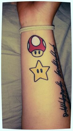 a person with a mushroom and star tattoo on their arm