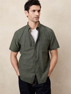 UNTUCKED FIT: Designed with a shorter hemline to hit right at the hips. Our casual lightweight 100% cotton shirt available in a variety of colors. Button down collar. Short sleeves. Button front closure. Chest pocket. Back yoke. Shirttail hem. Made exclusively for Banana Republic Factory. #460364 Banana Republic Factory, Chambray Shirt, Button Down Collar, Chest Pocket, Chambray, Cotton Shirt, Banana Republic, Button Down Shirt, Short Sleeves