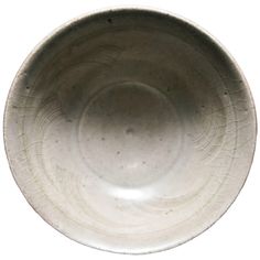 an empty white bowl is shown on a white background with no one around it or in the photo