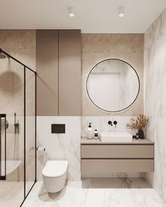 a bathroom with marble walls and flooring has a round mirror above the sink on the wall