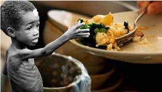 a young boy eating food from a plate on top of a table with other dishes