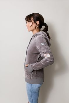 Our ladies' hoodie in a luxurious medium-weight Velour for the holidays. You can wear this super comfortable hoodie from the gym, on your errands, and straight into the holidays nights with this soft and cozy jacket. Equipped with front pockets, a sleeve pocket, and multiple inside pockets, there are plenty of options on this hoodie to store your phone on the move. Available in Black, Scarlett Red, and Smoke Silver Multiple “Phone Safe” inside pockets – we love options! Water repellent sleeve po Scarlett Red, Cozy Jacket, Velour Hoodie, Velour Fabric, Twill Tape, Cold Day, The Gym, Medium Weight, Front Zipper