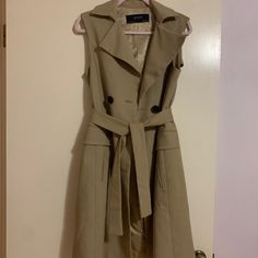 Zara Basic Collection Sleeveless Trench Coat Taupe/ Nude / Tan With Black Buttons Perfect Fall Staple! Size: X Small Like New Condition, Only Worn Once! Brown Sleeveless Formal Outerwear, Formal Brown Sleeveless Outerwear, Beige Workwear Vest, Khaki Sleeveless Outerwear For Spring, Sleeveless Khaki Outerwear For Spring, Elegant Beige Sleeveless Vest, Elegant Sleeveless Beige Vest, Brown Spring Workwear Vest, Brown Spring Vest For Workwear