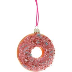 a pink donut ornament with sprinkles on it