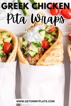 greek chicken pita wraps with cucumber, tomatoes and lettuce in them